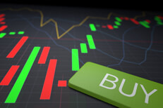 Buy key on candlestick price chart Buy key from laptop on top of stock candlestick chart showing stock price ranges by day