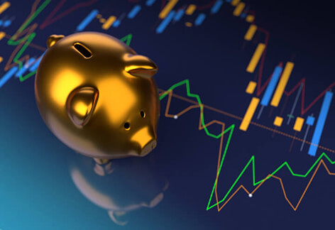Piggy bank on stock prices Shiny gold piggy bank on stock price charts representing investments