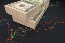 Bundled bills on line chart Two bundles of U.S. paper bills on stock price line chart and candlestick chart