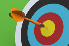 Hit the target Orange dart hitting target bulls eye with green background