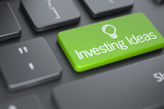 Computer keyboard with large green Investing Ideas key concept