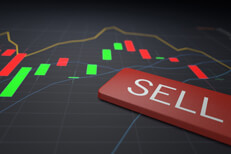 Sell stocks Sell keyboard key on stock price candlestick chart representing stock sale