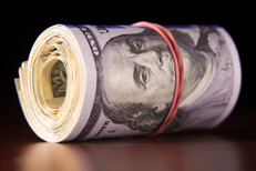 100 dollar bill roll reflection Roll of 100 dollar bills reflected