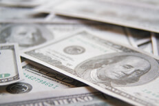 Scattered 100 dollar bills shallow depth of field Scattered 100 dollar bills with shallow depth of field blur