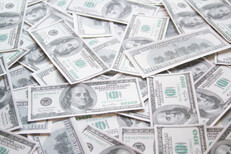 Thousands of dollars in $100 bills scattered on ground