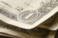 Corner view of stack of dollar bills Free photo of random stack of one dollar bills corner view