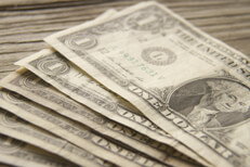 Photo of fanned dollar bills Free photo of dollar bills fanned out on wood background