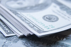 Large stack of $100 bills Large, messy stack of $100 bills on top of scattered $100 bills