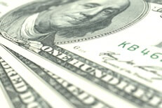 Image showing three 100 dollar U.S. bills close up at angle with short depth of field