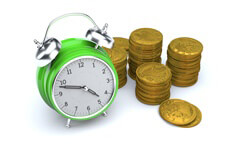 Concept image of green clock with stacks of gold U.S. coins