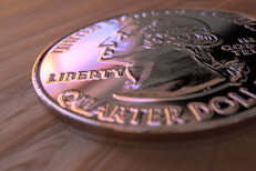 Quarter on wood U.S. quarter lying on wood table with nice window reflection