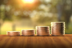 Increasing stacks of coins Four stacks of coins increasing to show investment growth