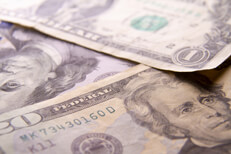 U.S. currency bills Miscellaneous U.S. currency bills scattered