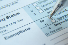 Form 1040 Exemptions field Close up photo of IRS form 1040 Exemptions fields with ballpoint pen checking the Single box