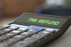 Calculator LCD Tax Refund Calculator with LCD reading Tax Refund with nice interior bokeh background