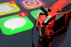 Rollover accident on top of shiny iPhone screen showing text message icon