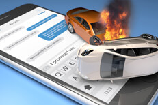 Two car accident with fire on top of iPhone with screen showing text messages